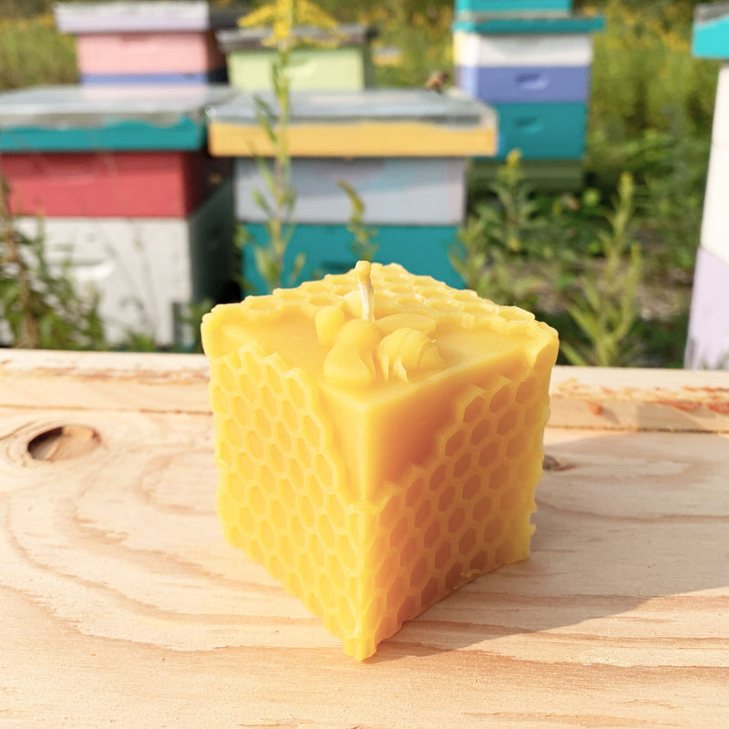 Beeswax cube candle with honeycomb pattern